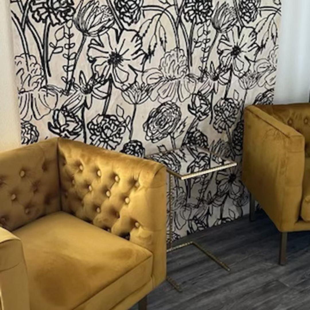 Gold chairs in the studio waiting area